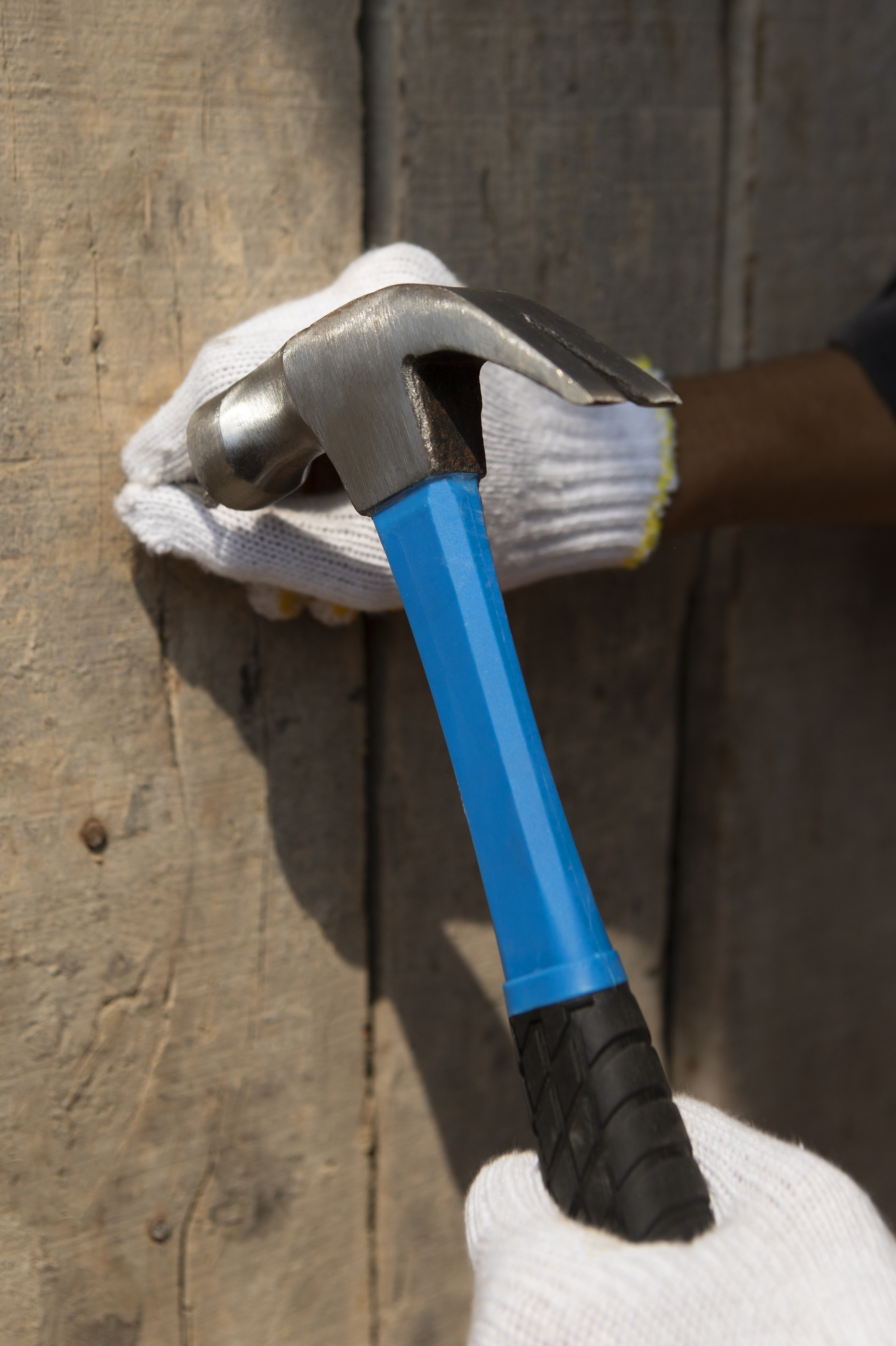 construction worker using hammer job site